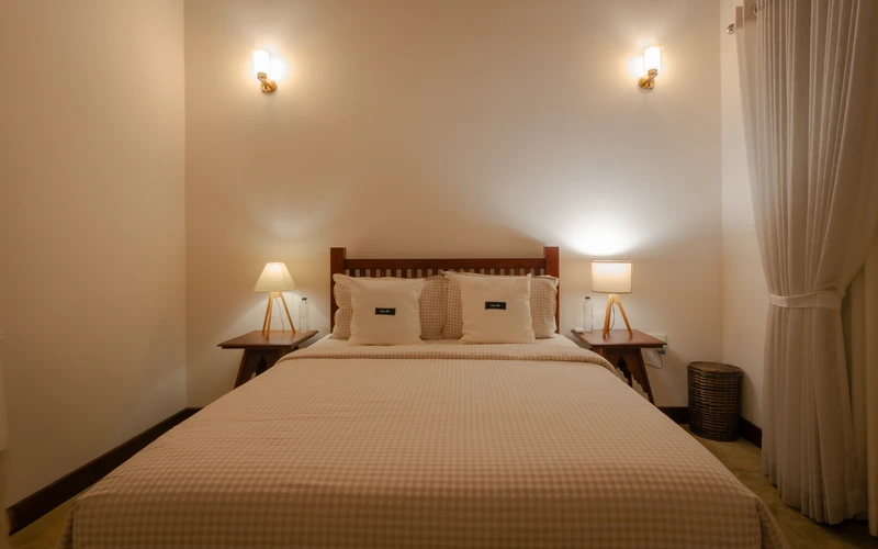Peaceful queen guest room at Sevana Villa with soft linens and natural light