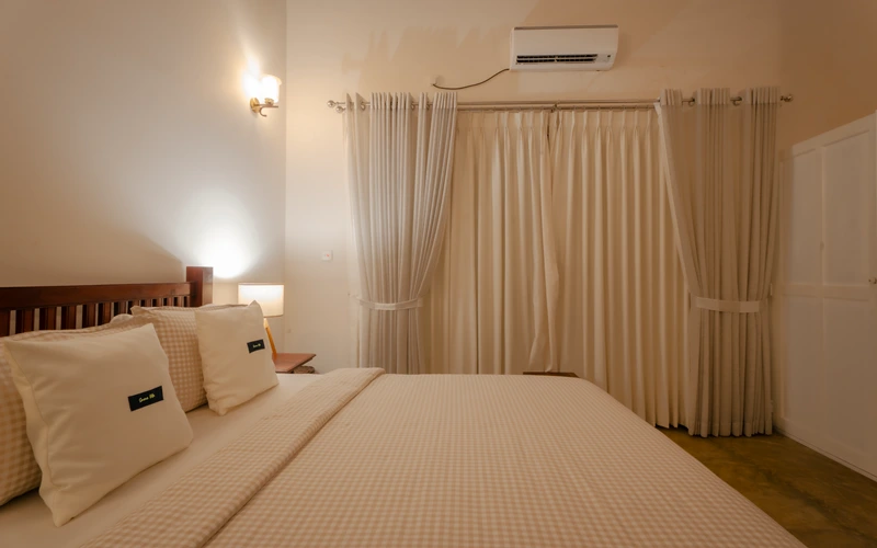 Queen guest room at Sevana Villa with fresh linens and garden outlook
