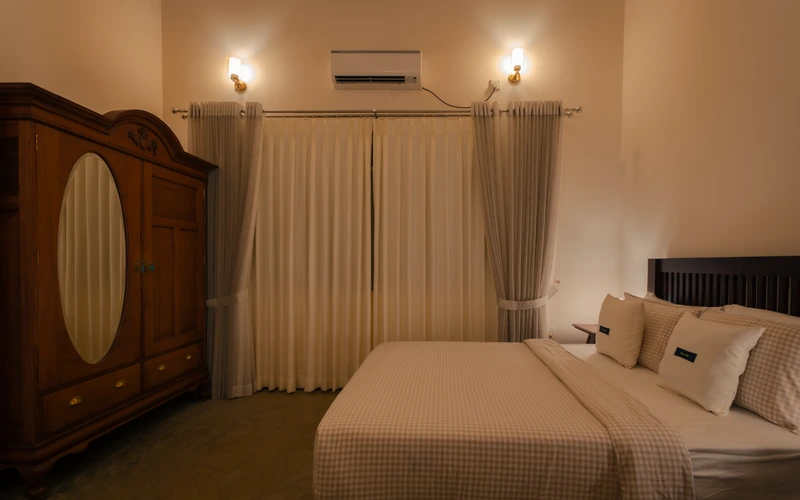 Master Suite at Sevana Villa with king bed and a private balcony overlooking the garden and pool